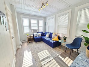 Front Living Room featuring Couch that rolls out into a Double Sleeper