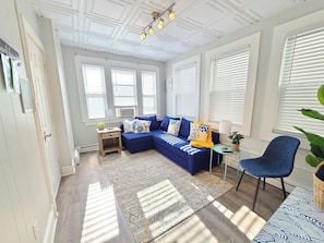 Front Living Room featuring Couch that rolls out into a Double Sleeper