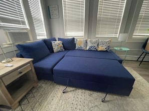 Front Living Room featuring Couch that rolls out into a Double Sleeper