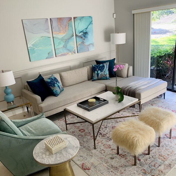 Living Room with Large Screen TV overlooking Private Yard