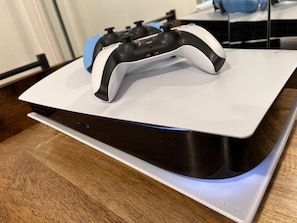 Brand new PlayStation 5 with 5 games included.