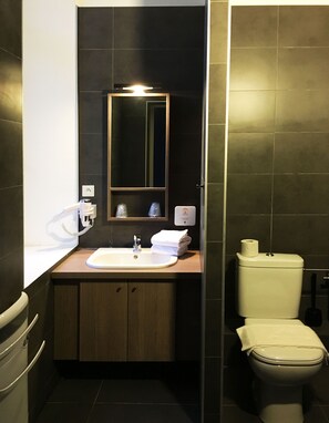 Freshen up in the bathroom after a day of adventure.
