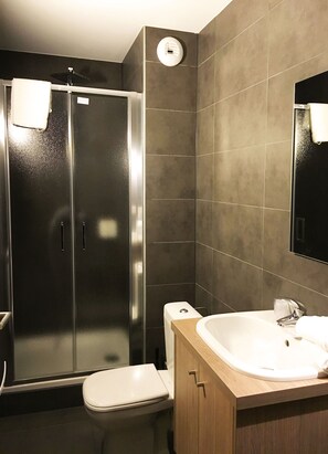 Freshen up in the bathroom after a day of adventure.