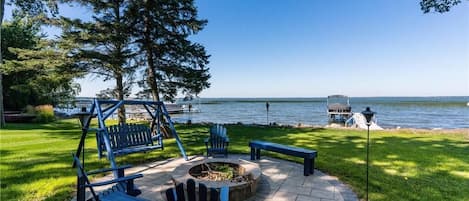 Plentiful seating, great views, fire pit and yard space and beach to enjoy.