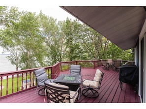 Enjoy grilling and the expansive outdoor deck with plentiful seating.
