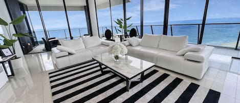 Uninterrupted ocean views from a beautifully styled living room and balcony