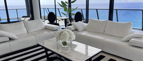 Uninterrupted ocean views from a beautifully styled living room and balcony