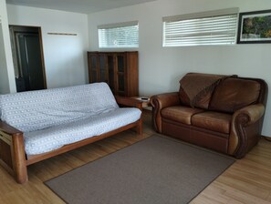 Waterfront Cabin - Living Room Equipped with Sofa Sleeper and 32-inch Smart TV.