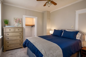 Cozy full size bed next to spacious closet and dresser; perfect for unpacking and relaxing!