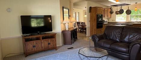 Great room w/ TV, seating & kitchen