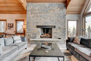 Cozy Up With A Good Book In Front Of This One Of A Kind Custom Stone Wall With Gas Wood Fireplace