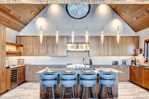 The Stunning Chef's Kitchen With Custom Cabinetry & Lighting Fixtures