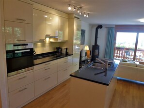Cabinetry, Countertop, Property, Tap, Sink, Kitchen Appliance, Kitchen Stove, Kitchen, Kitchen Sink, Wood