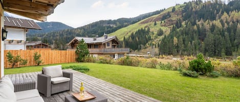 Plant, Sky, Cloud, Property, Furniture, Couch, Building, Tree, Natural Landscape, Mountain