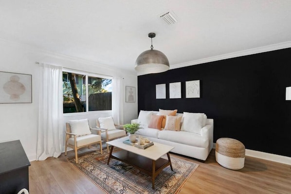 Cozy Living Room Bathed in Natural Light - Where Comfort and Sunshine Combine
