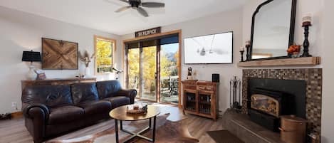 Living Room with Fireplace and Deck