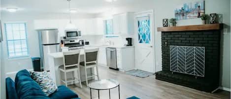 Family room attached to kitchen with gas fireplace and SMART TV

