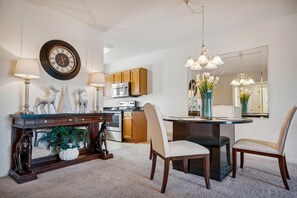 The Cheery Dining Table Seats A Crowd! - Centrally located between living room and kitchen, the dining table makes a great game and puzzle spot, too!