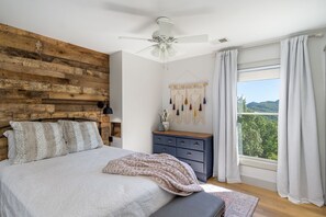 3rd bedroom, with barn wood wall custom niches, amazing views