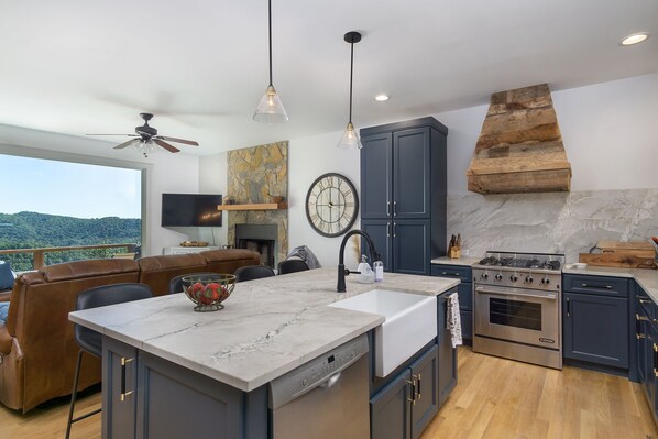 Main Level kitchen living area fireplace huge picture window open floor plan