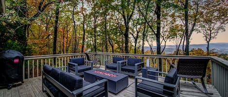 Deck with a fire pit and incredible views