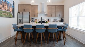 Prepare your favorite meal in our well equipped kitchen, then gather around the spacious island.
