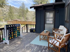 Watch the kiddos play in the yard in this cozy seating area on back deck.