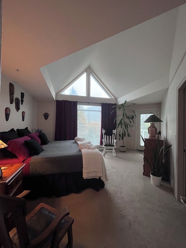 Master bdrm - king bed, south deck -  bathroom/shower stall & tub.