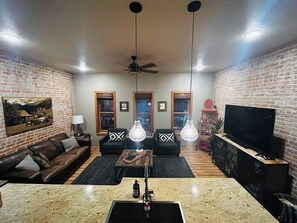 Enjoy the open living room and kitchen with 3 beautiful windows looking over F street. (3)