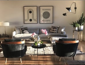 Morning shot of great room. Open floor plan w/ floor-to-ceiling views of valley