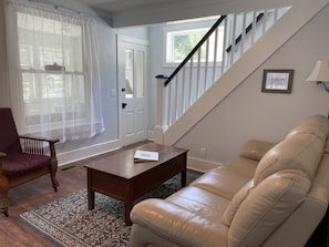 Living room has seating for 7 and TV