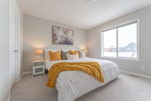 Master bedroom with a king-size bed