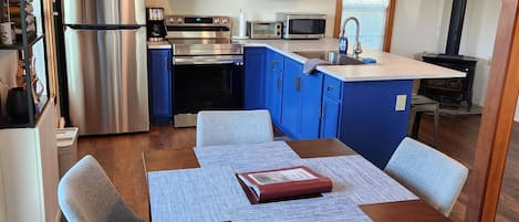 View of dining room and kitchen.