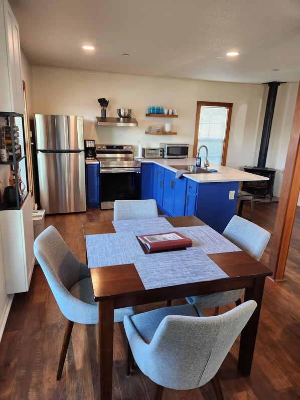 View of dining room and kitchen.