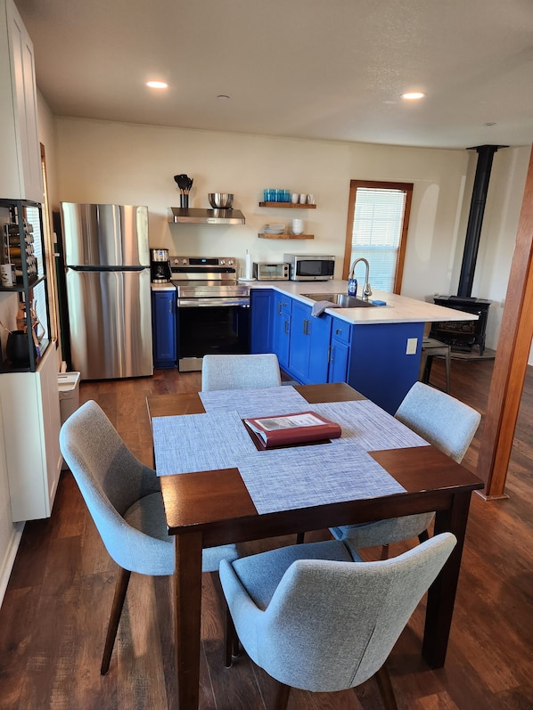 View of dining room and kitchen.