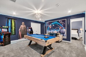 Challenge your friends and family in the game room featuring a pool table and more.