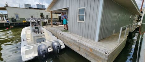 Back porch with room for docking up to 42’ boat and a beautiful view!