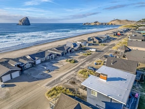 Aerial view of the property facing the beach and the rock