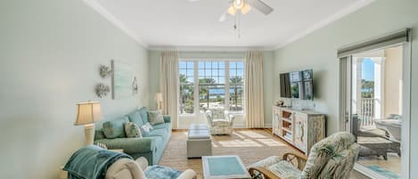 Living area with flat screen TV and sofa bed.