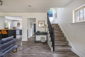 The stairway leads up to three bedrooms and second-floor full bathroom.