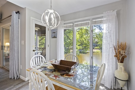 Cute Dining Table with Lagoon Views and access to the screened in porch