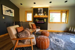 Living room with electric fireplace.
