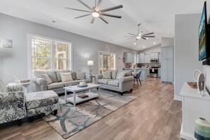 Begin by relaxing in the appealing, coastal inspired open concept Living/Dining/Kitchen.