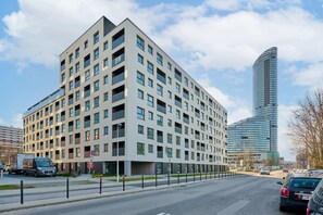 An exterior view of the modern apartment building, showcasing its contemporary architecture.
