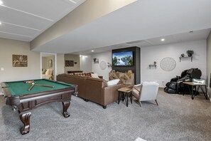 Enjoy the downstairs game room with 75" TV