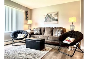 Livingroom to sit and relax includes Queen sleeper sofa.