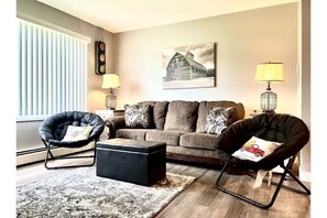 Livingroom to sit and relax includes Queen sleeper sofa.