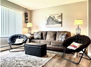 Livingroom to sit and relax includes Queen sleeper sofa.