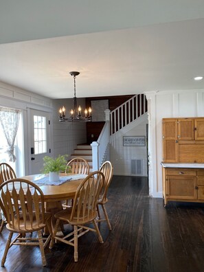 Kitchen area with antique table and Hoosier cabinet.