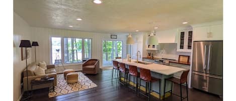 Open kitchen with sitting area and dining area.